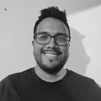 Alberto smiling with glasses on